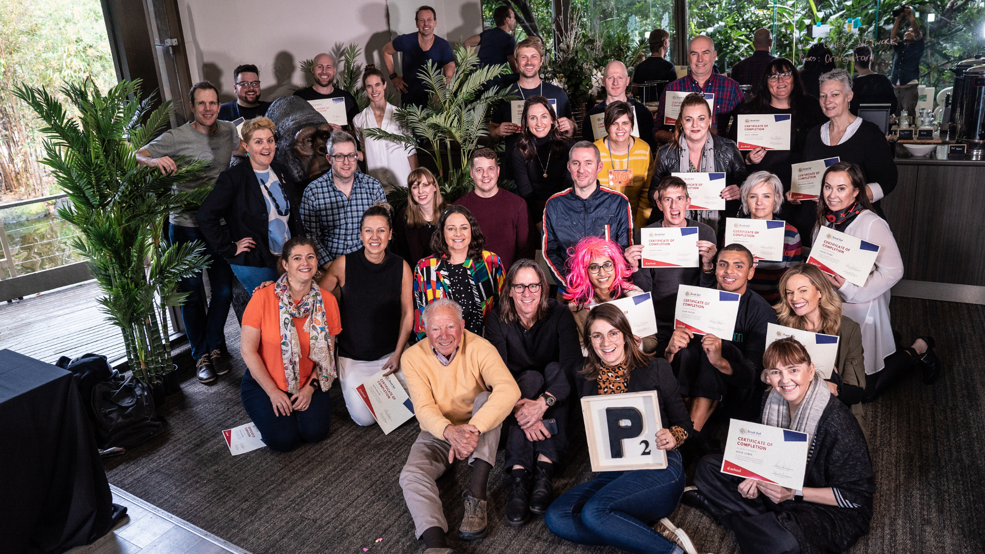Group of BREAK OUT participants holding certificates of completion